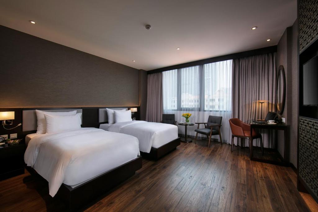 Postel nebo postele na pokoji v ubytování Grandiose Hotel & Spa
