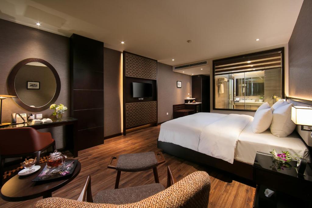 Postel nebo postele na pokoji v ubytování Grandiose Hotel & Spa