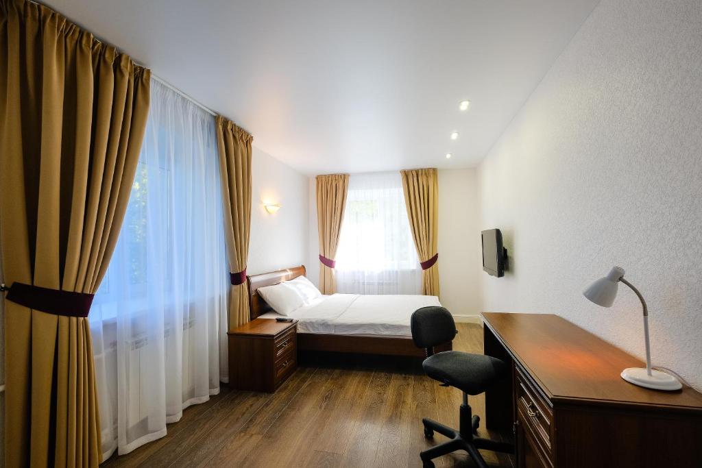 Llit o llits en una habitació de Apartments Petrovskie on Kirova 39A