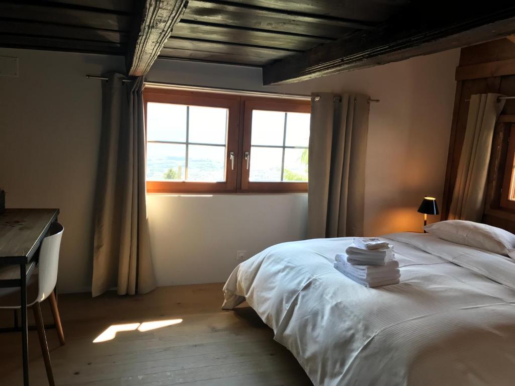 Postel nebo postele na pokoji v ubytování La Grande Maison