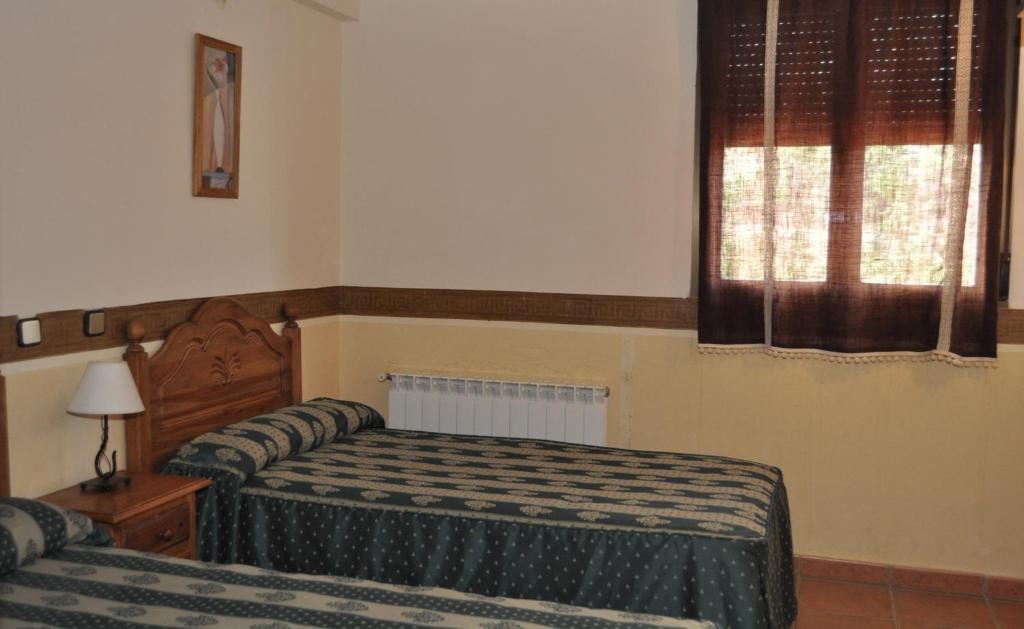 Postel nebo postele na pokoji v ubytování La Fuensanta Hostal-Rural