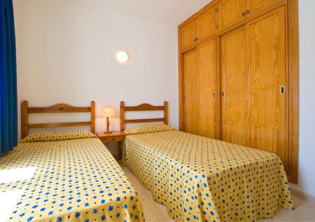 Postel nebo postele na pokoji v ubytování Apartamentos Club Pocillos