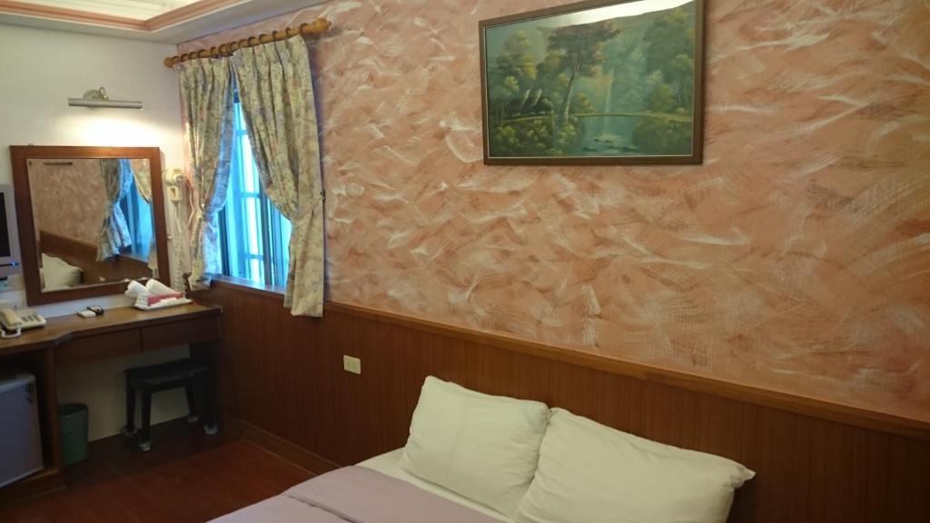 Postel nebo postele na pokoji v ubytování Umin Chu Inn