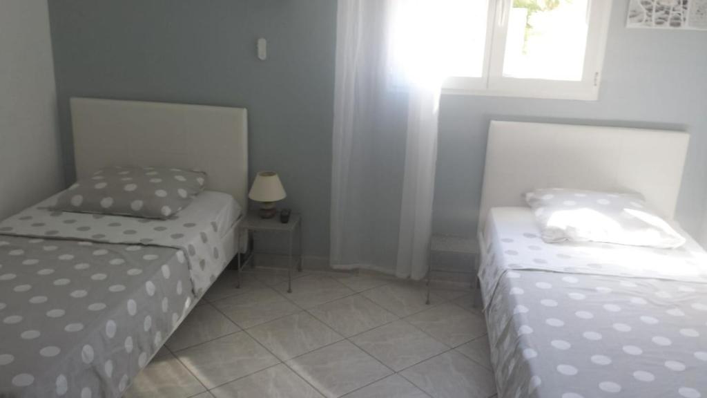 Postel nebo postele na pokoji v ubytování Villa Jasmin