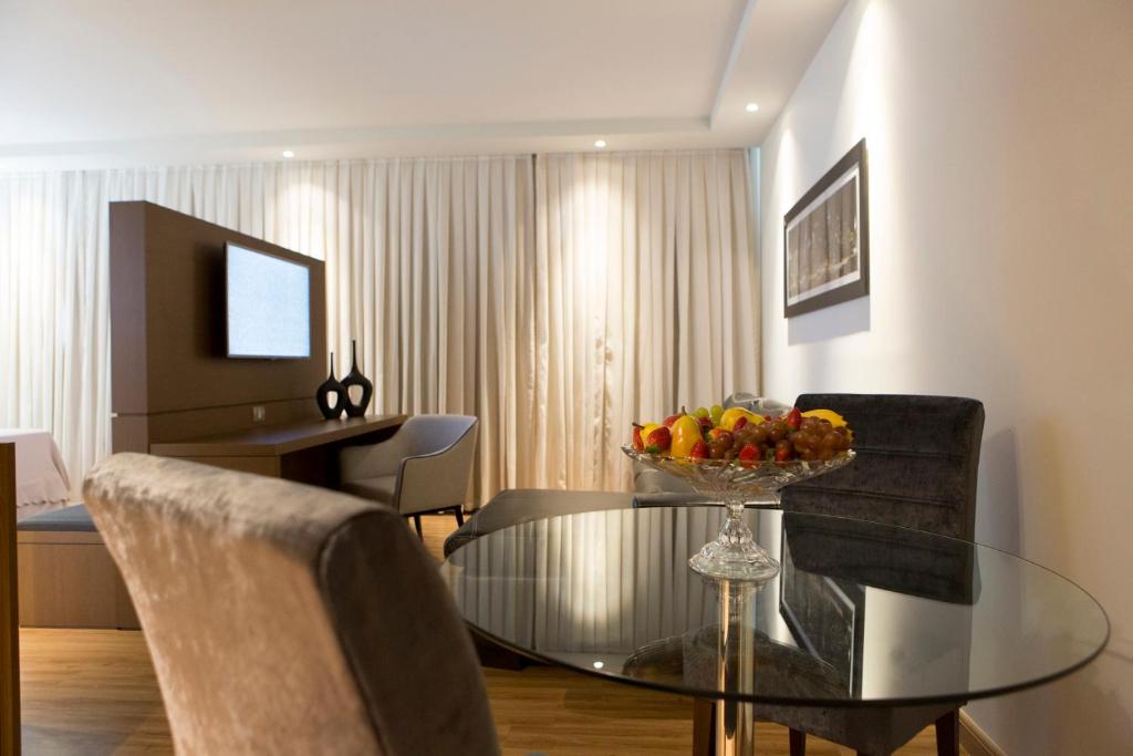 TV a/nebo společenská místnost v ubytování Hotel Caiuá Cascavel