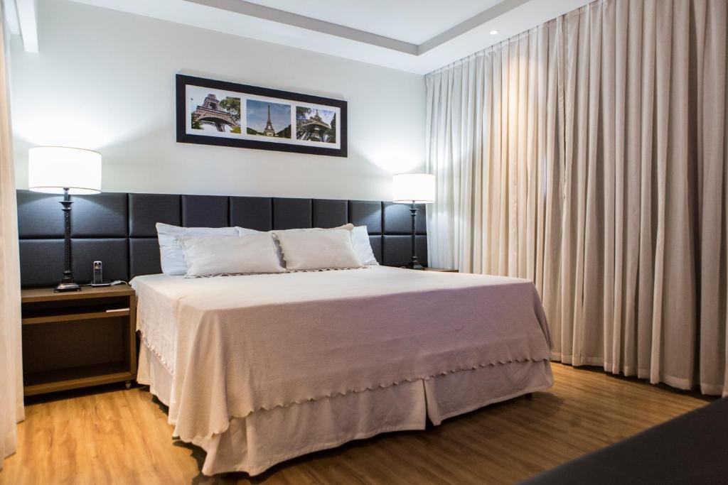 Postel nebo postele na pokoji v ubytování Hotel Caiuá Cascavel