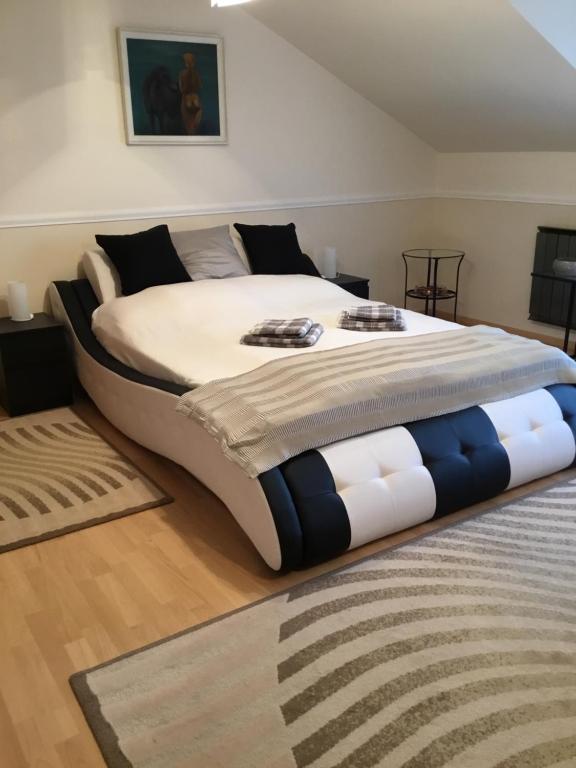 a large bed in a room with a large bed sidx sidx at 3 Bedroom Private floor in Luxury Mansion in Budapest
