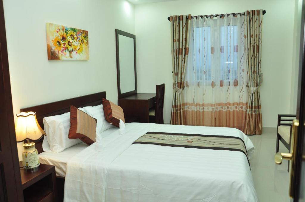 Postel nebo postele na pokoji v ubytování Dattravi Hostel