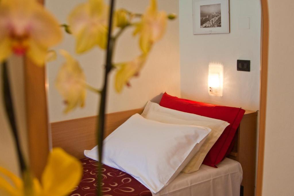Postel nebo postele na pokoji v ubytování Hotel Hamilton