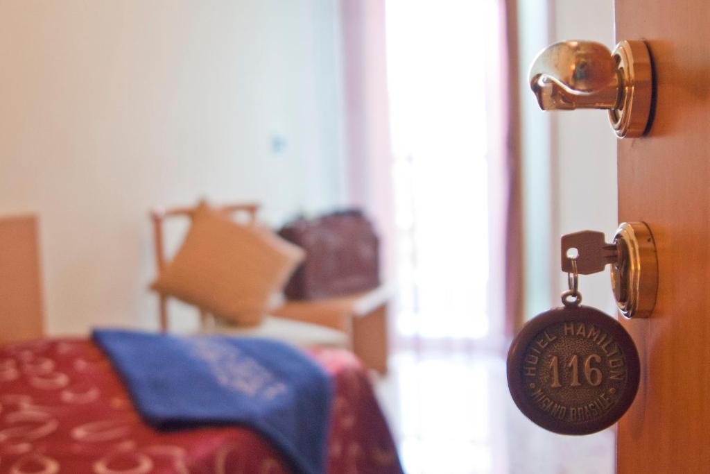 Postel nebo postele na pokoji v ubytování Hotel Hamilton