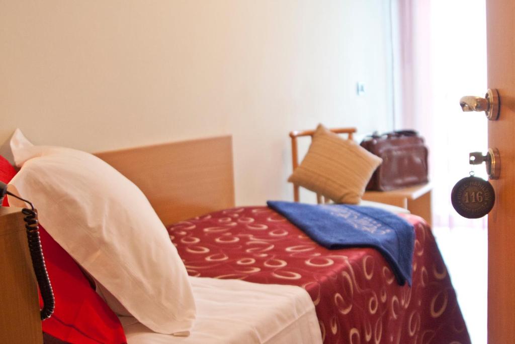 Postel nebo postele na pokoji v ubytování Hotel Hamilton