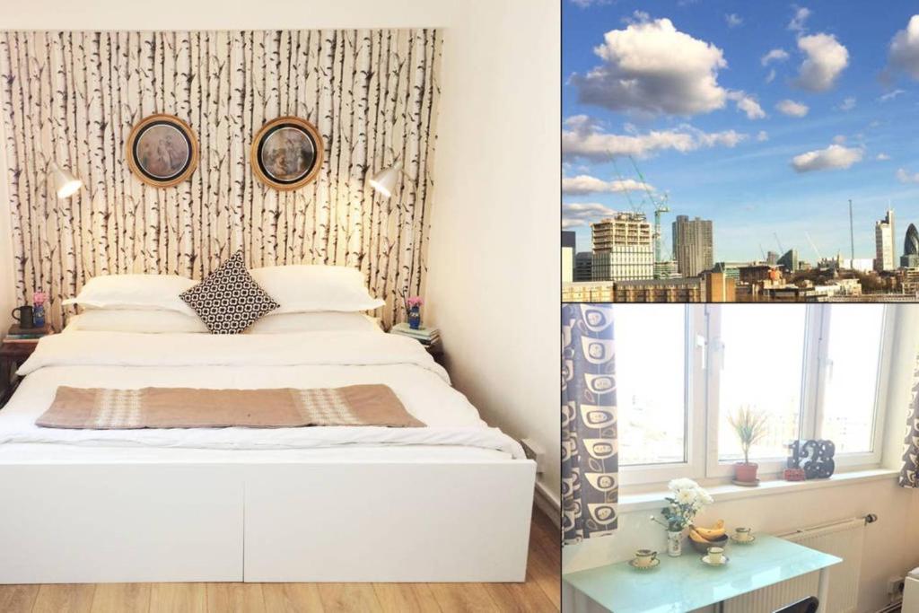 - une chambre avec un lit blanc et une fenêtre dans l'établissement Dreamy Shoreditch Flat w/ Views in Old St (Zone 1), à Londres