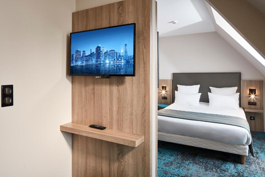Postel nebo postele na pokoji v ubytování Hôtel Maison Turenne