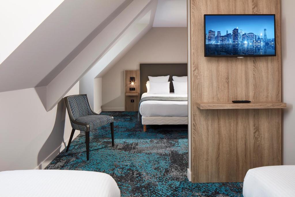 Postel nebo postele na pokoji v ubytování Hôtel Maison Turenne