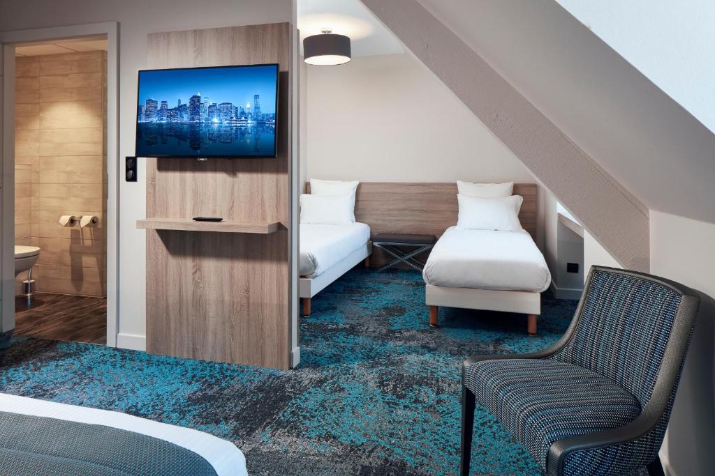 Postel nebo postele na pokoji v ubytování Hôtel Maison Turenne