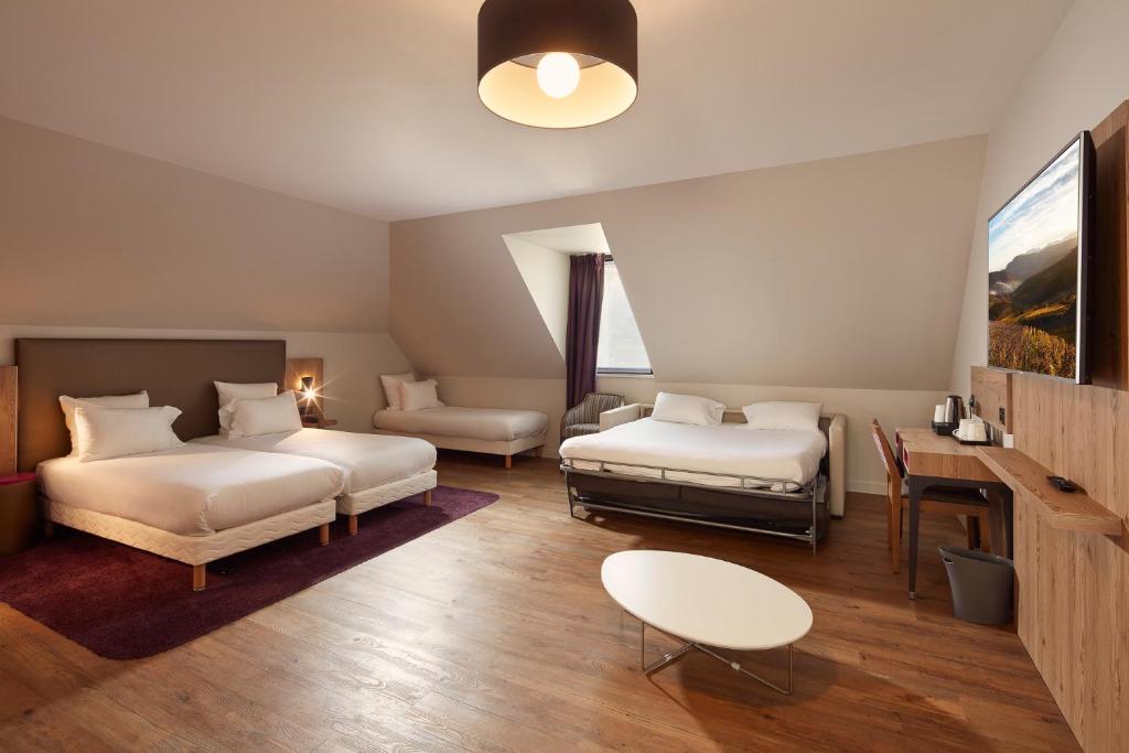 Postel nebo postele na pokoji v ubytování Hôtel Maison Turenne