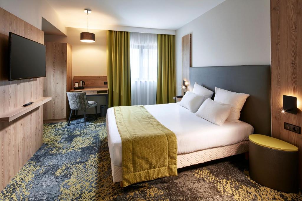 Postel nebo postele na pokoji v ubytování Hôtel Maison Turenne