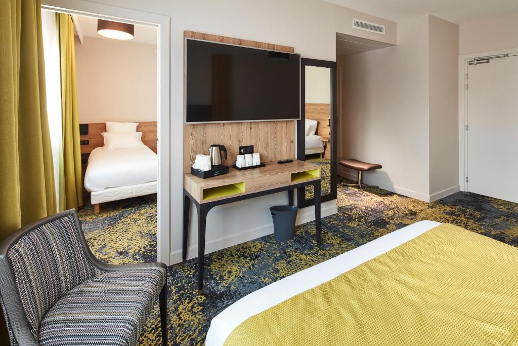 Postel nebo postele na pokoji v ubytování Hôtel Maison Turenne