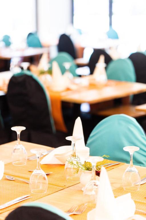 Reštaurácia alebo iné gastronomické zariadenie v ubytovaní T Hotel Premium Suites