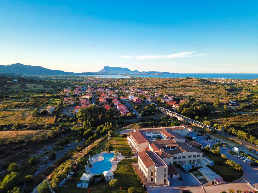 an aerial view of a town with the ocean at Hotel San Teodoro in San Teodoro