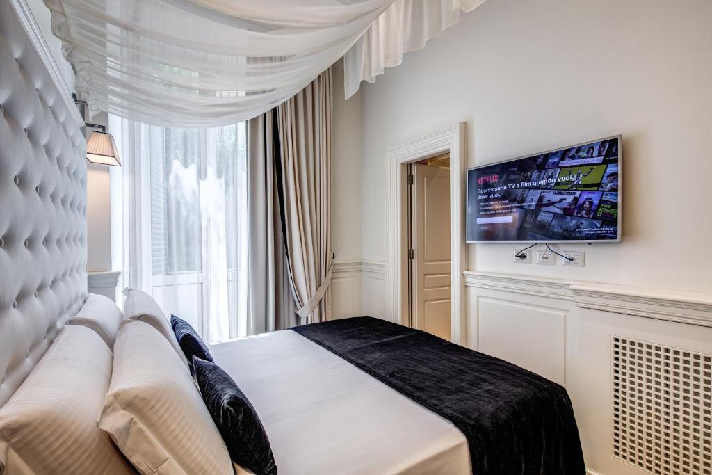 TV a/nebo společenská místnost v ubytování Hotel dei Quiriti Suite