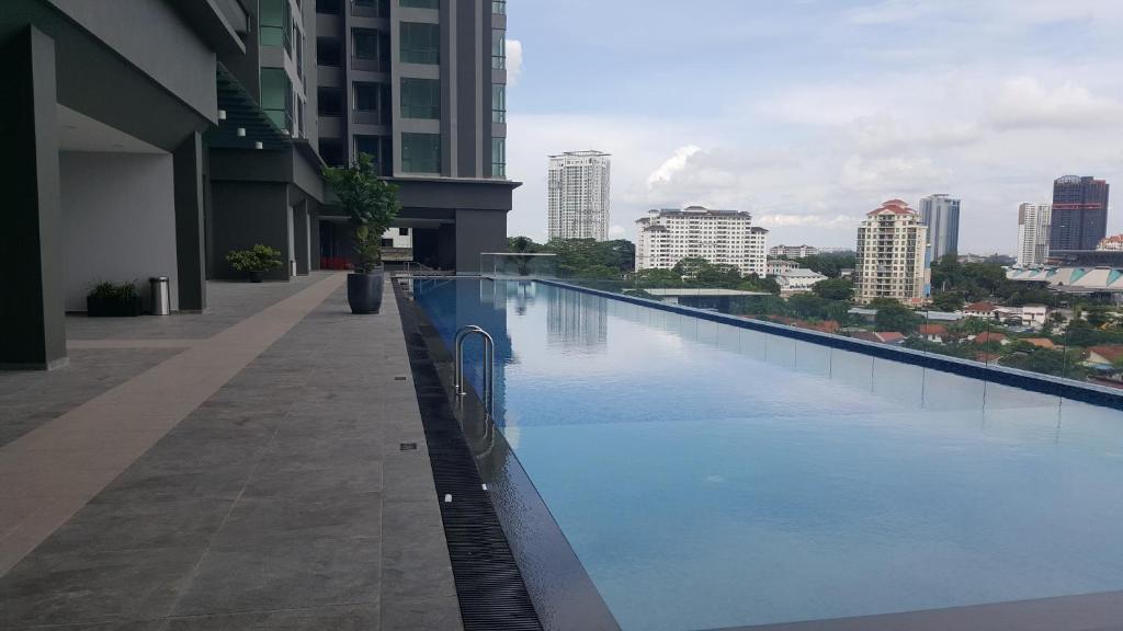 a large swimming pool on the side of a building at SKS Pavillion Residences in Johor Bahru