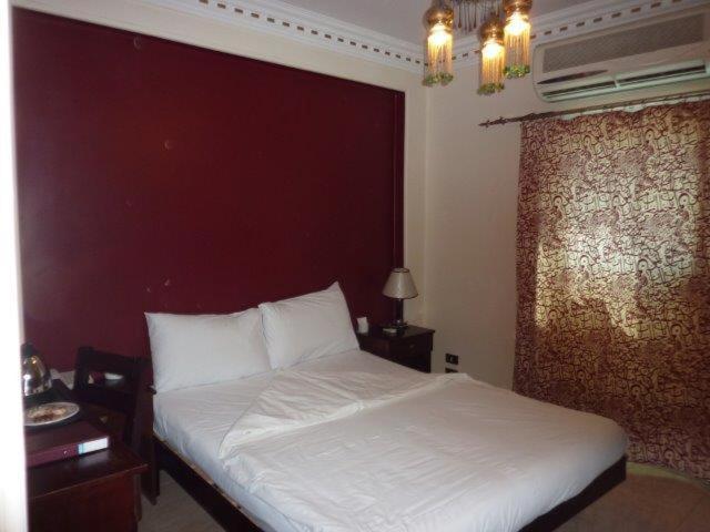 Postel nebo postele na pokoji v ubytování Philae Hotel Aswan
