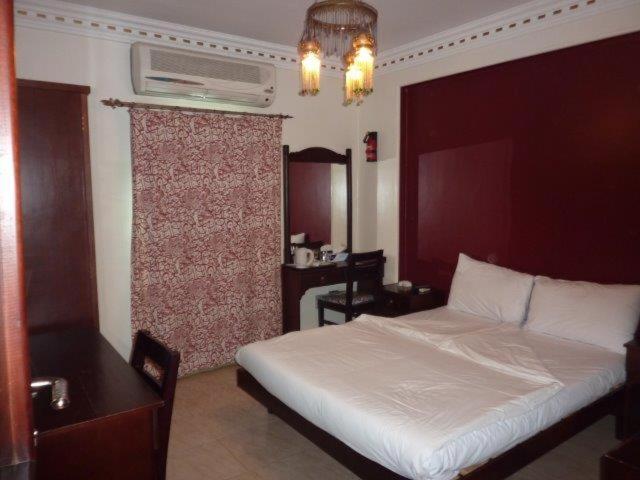 Postel nebo postele na pokoji v ubytování Philae Hotel Aswan