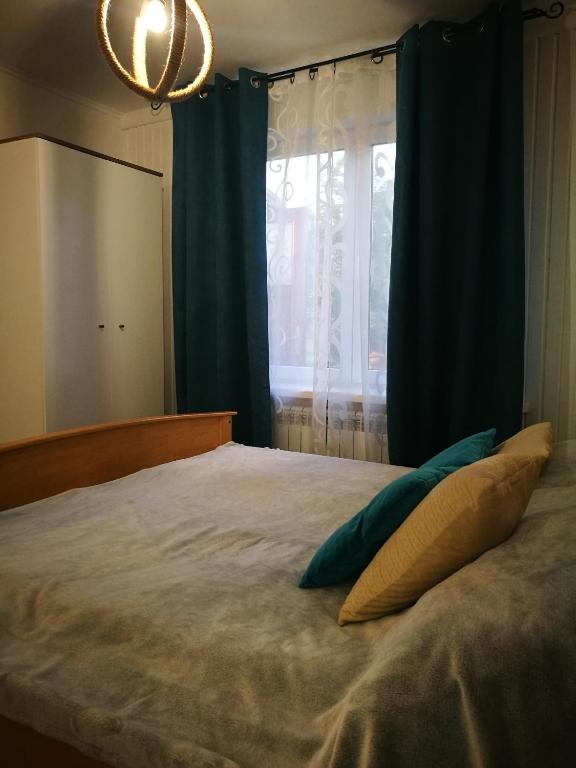 Posteľ alebo postele v izbe v ubytovaní Dom nad Wigrami