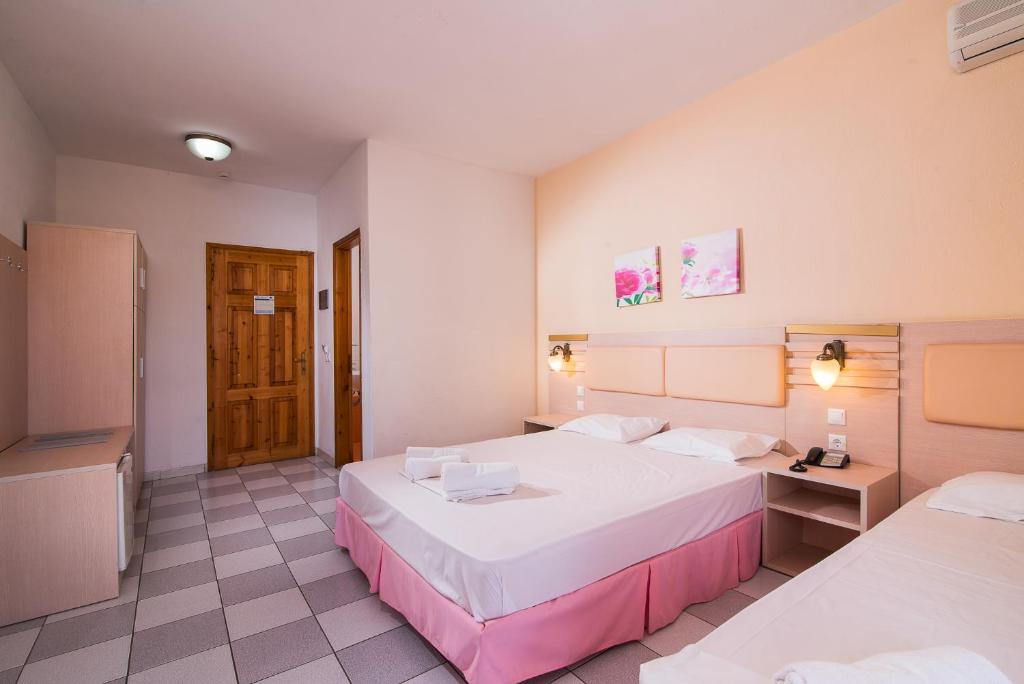 Postel nebo postele na pokoji v ubytování Hotel Calypso