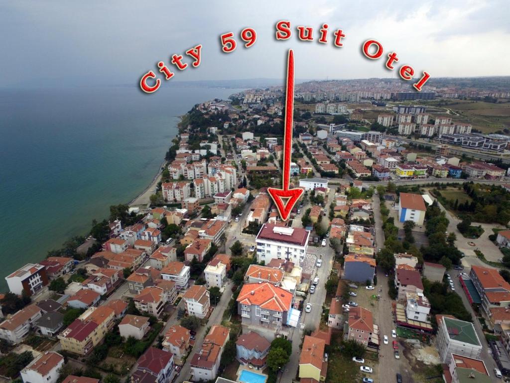 an aerial view of a city with a red arrow at city59 Suit Otel in Köseilyas