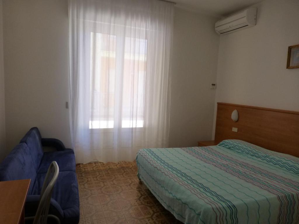 Postel nebo postele na pokoji v ubytování Hotel Sole