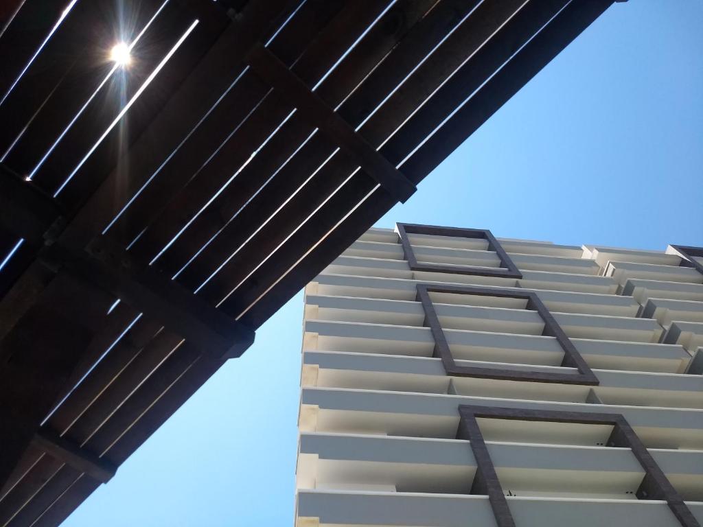 a view of a building from underneath a bridge at Altara in Boca del Río