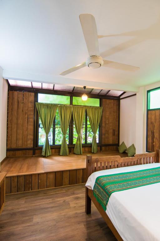 Кровать или кровати в номере Pak Chiang Mai