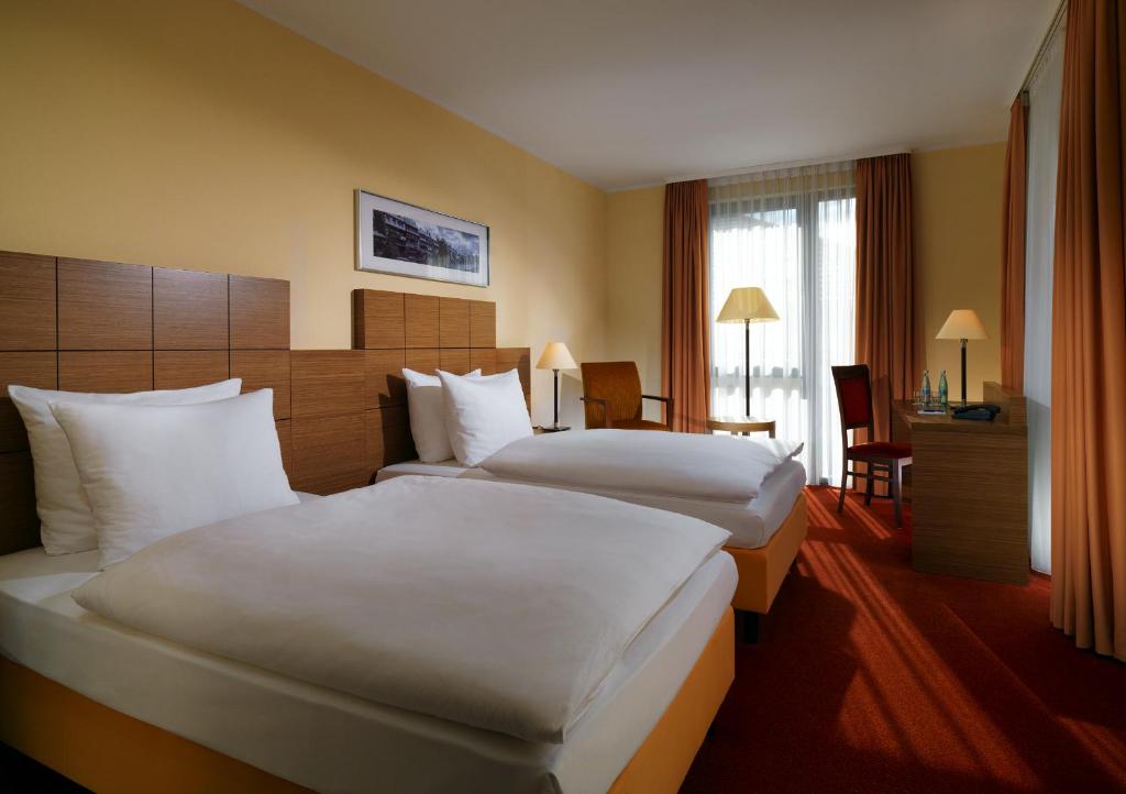 Postel nebo postele na pokoji v ubytování Best Western Hotel Bamberg