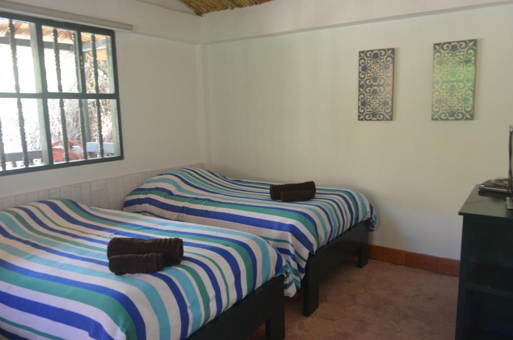 Postel nebo postele na pokoji v ubytování Hacienda Gonzabal