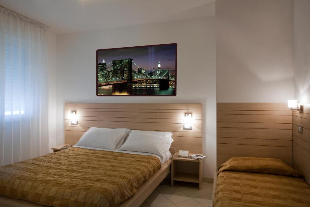 A bed or beds in a room at Residence Il Tulipano