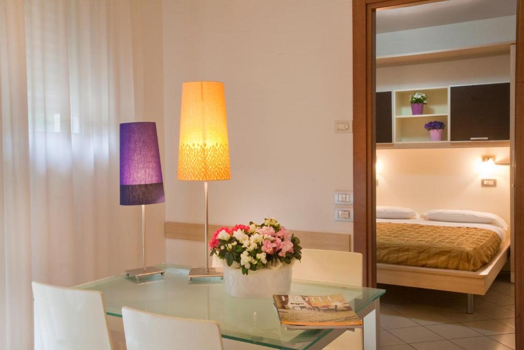 A bed or beds in a room at Residence Il Tulipano