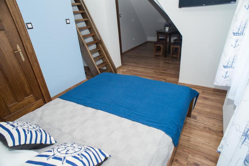 Postel nebo postele na pokoji v ubytování Zabytkowy Dom Latarników