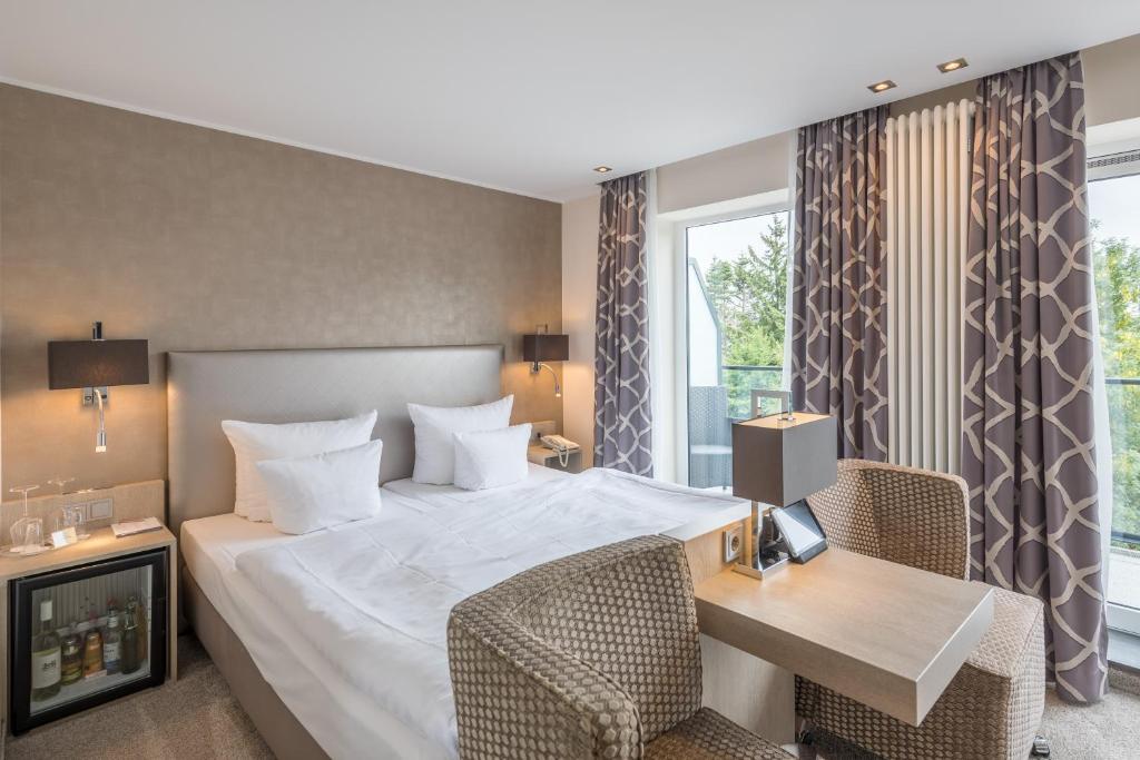 Postel nebo postele na pokoji v ubytování Thomas Hotel Spa & Lifestyle