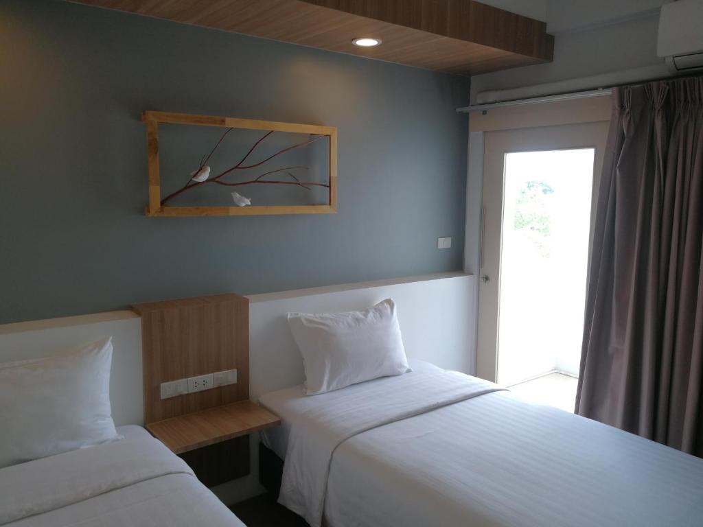 Postel nebo postele na pokoji v ubytování Shade House - Bitec Bangna
