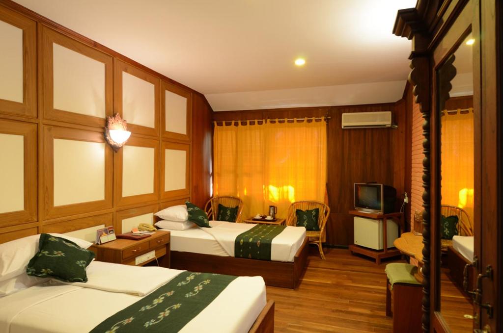 Postel nebo postele na pokoji v ubytování KMA Bagan Hotel
