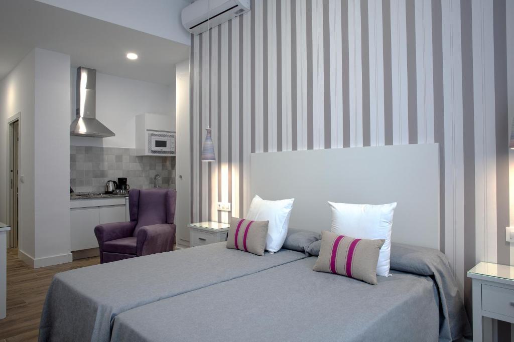 Posteľ alebo postele v izbe v ubytovaní Hotel Apartamentos MPD