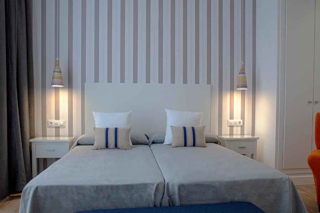 Posteľ alebo postele v izbe v ubytovaní Hotel Apartamentos MPD