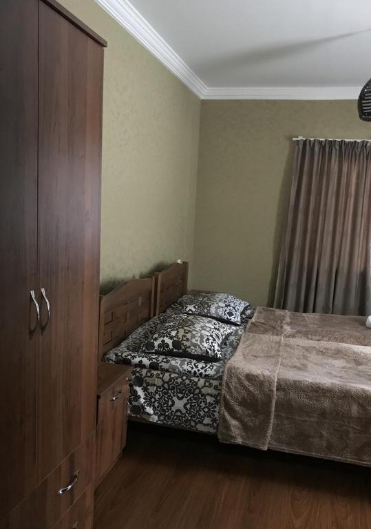 Postel nebo postele na pokoji v ubytování Guesthouse Chela