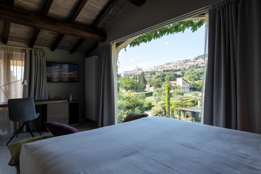 A bed or beds in a room at Tenuta San Masseo - boutique farm resort & SPA