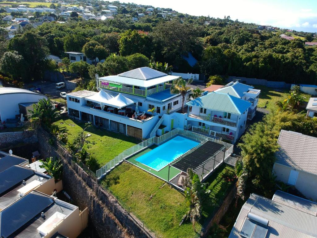 an aerial view of a house with a swimming pool at Hôtel Le Soleil Couchant in Saint-Pierre