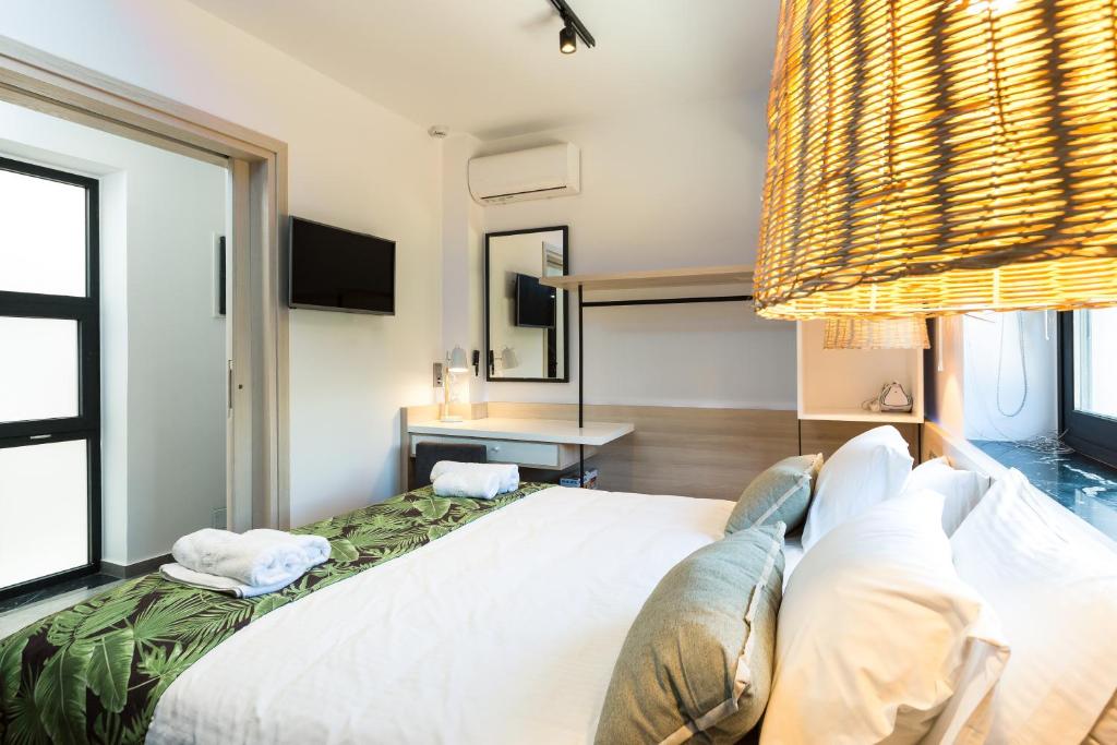 Posteľ alebo postele v izbe v ubytovaní T Hotel Premium Suites