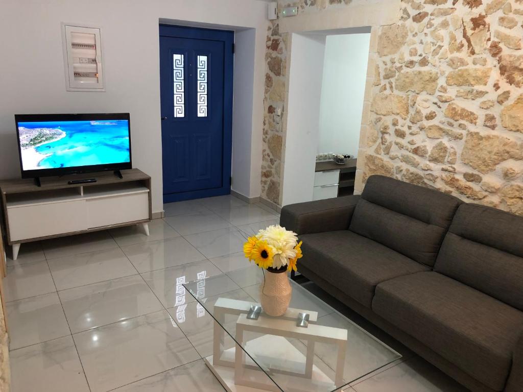 Televízia a/alebo spoločenská miestnosť v ubytovaní Wave Apartment