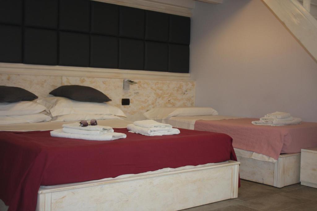 Posteľ alebo postele v izbe v ubytovaní Margherita Room